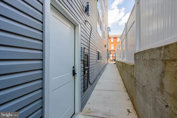 a view of a pathway both side of house