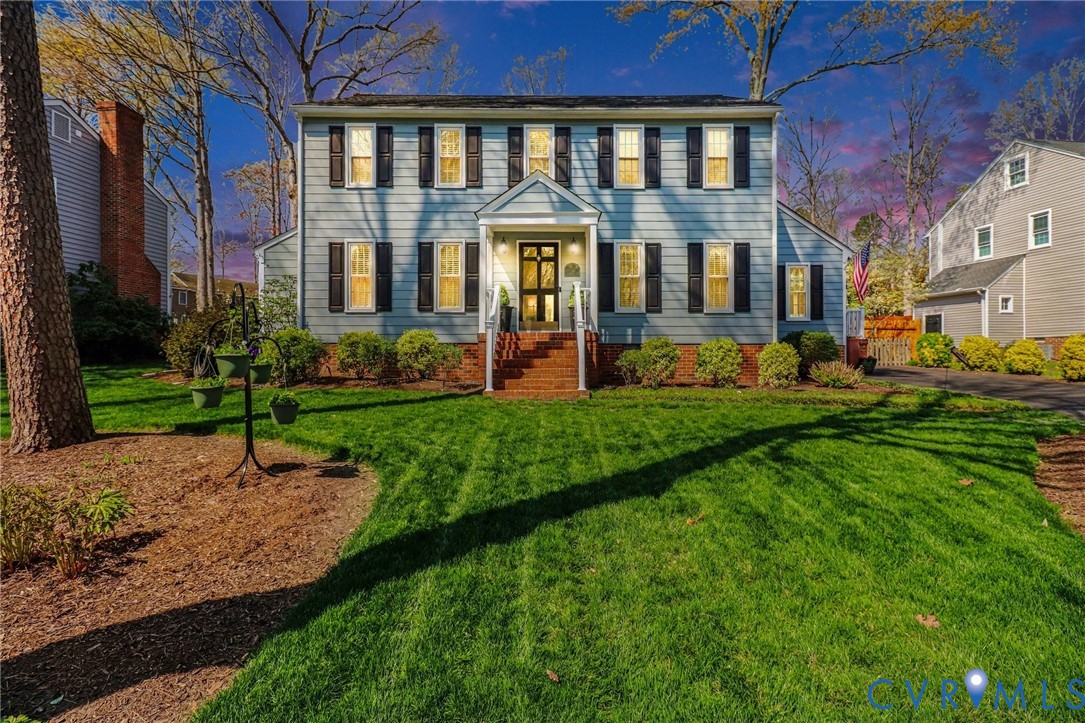 548 Glenmeadow Road Midlothian, VA 23114 - Photo 21 of 31 a front view of a house with a yard table and chairs