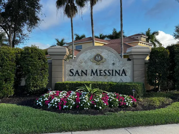 a view of sign board with flower around