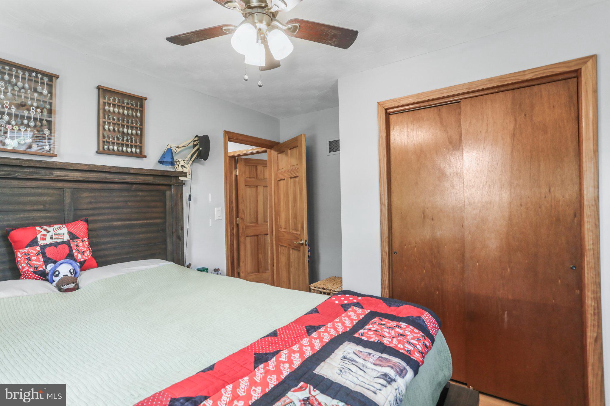 1734 Cemetery Road York, PA 17408 - Photo 21 of 52 Cozy bedroom with warm wooden accents.