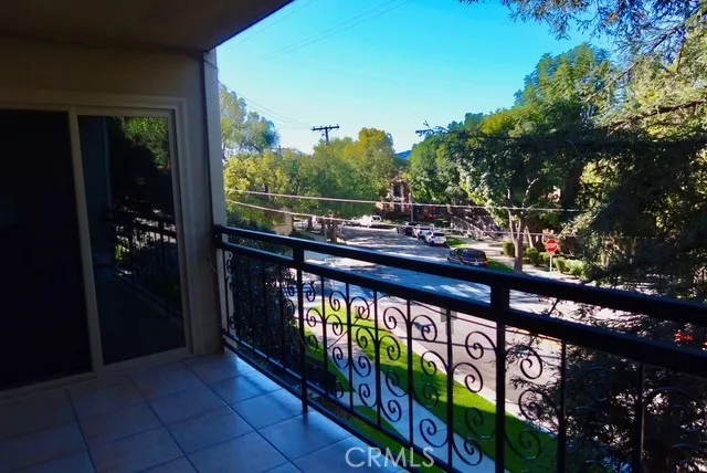 a view of a street from a balcony
