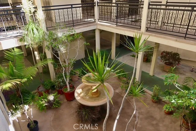 a flower pot with a table and chair