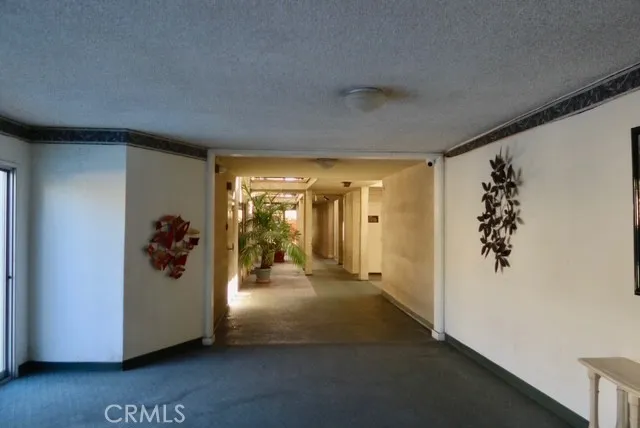 a view of a hallway view with staircase