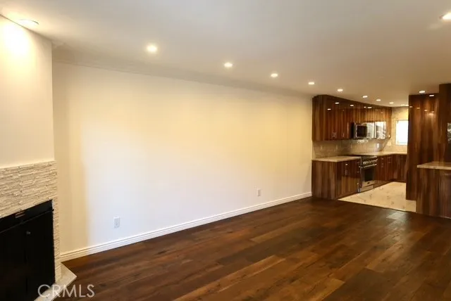 a view of kitchen with cabinets