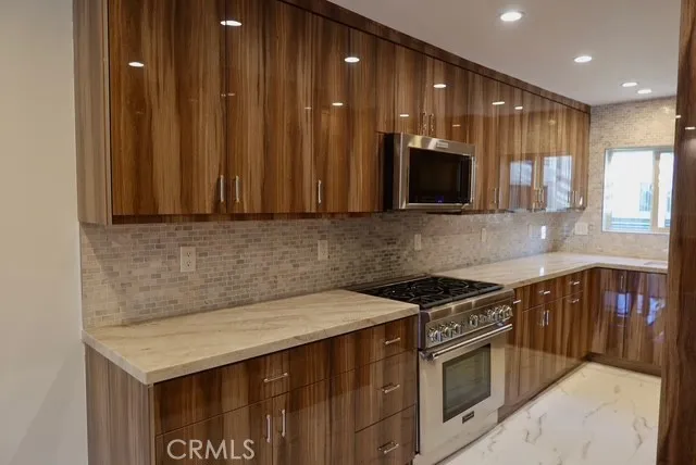 a kitchen with a stove and a microwave