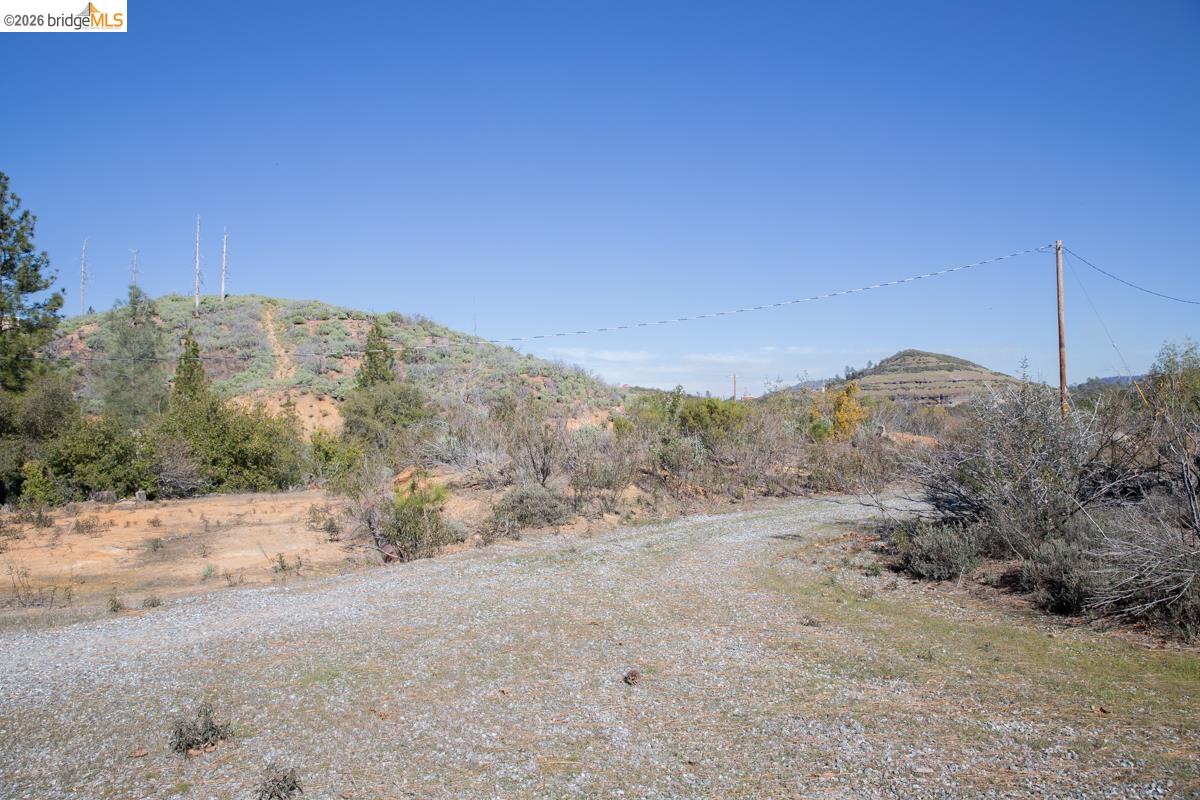7329 Eagle View Drive Mountain Ranch, CA 95246 - Photo 2 of 11 a view of a road with a mountain in the background