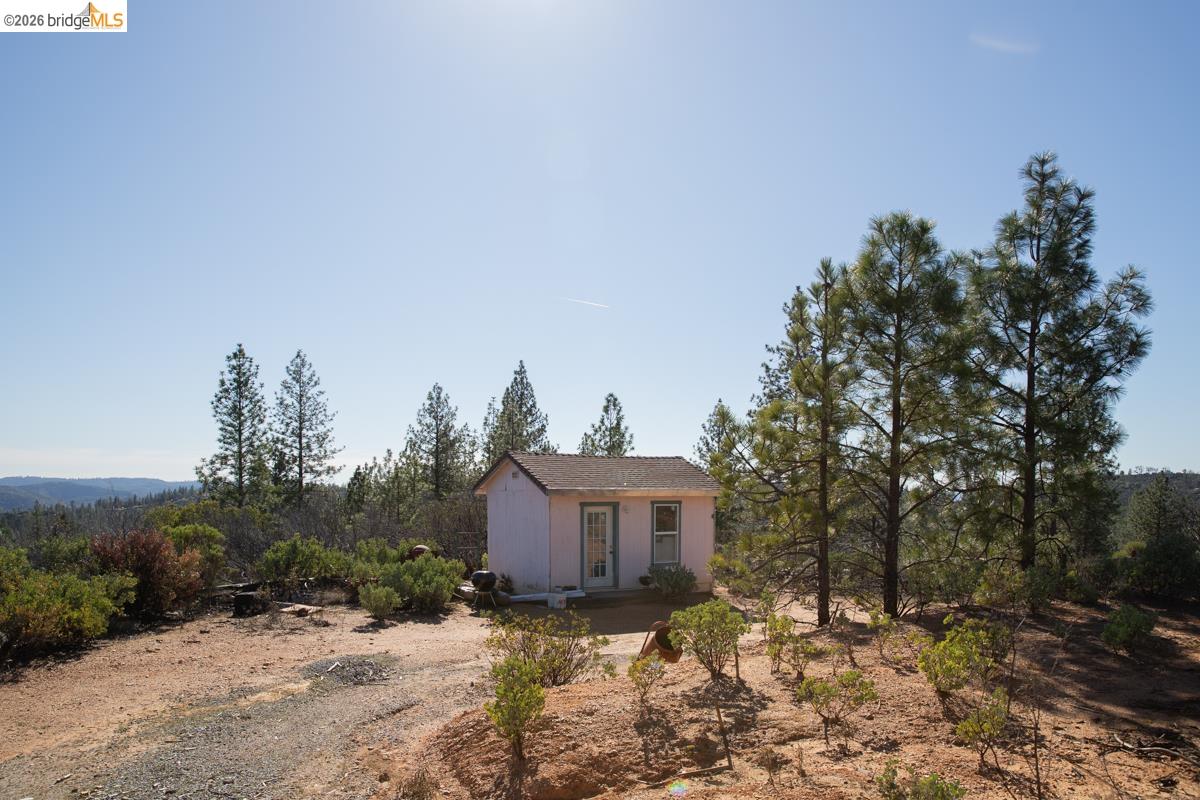 7329 Eagle View Drive Mountain Ranch, CA 95246 - Photo 9 of 11 a view of a house with a yard