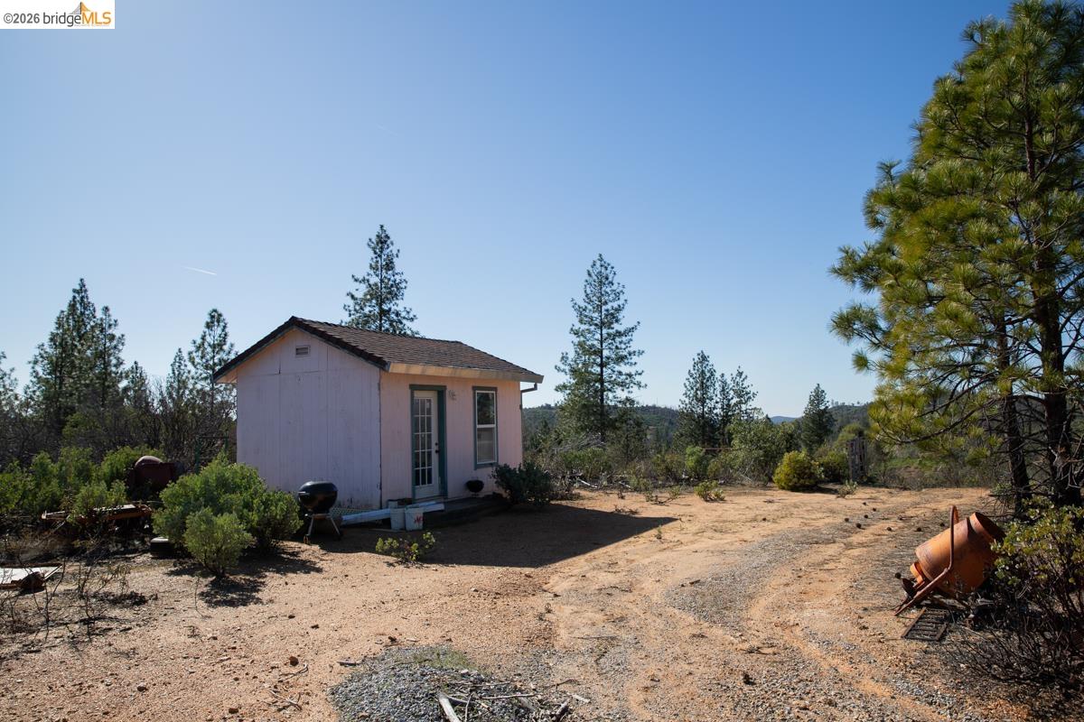 7329 Eagle View Drive Mountain Ranch, CA 95246 - Photo 10 of 11 a view of a house with a yard