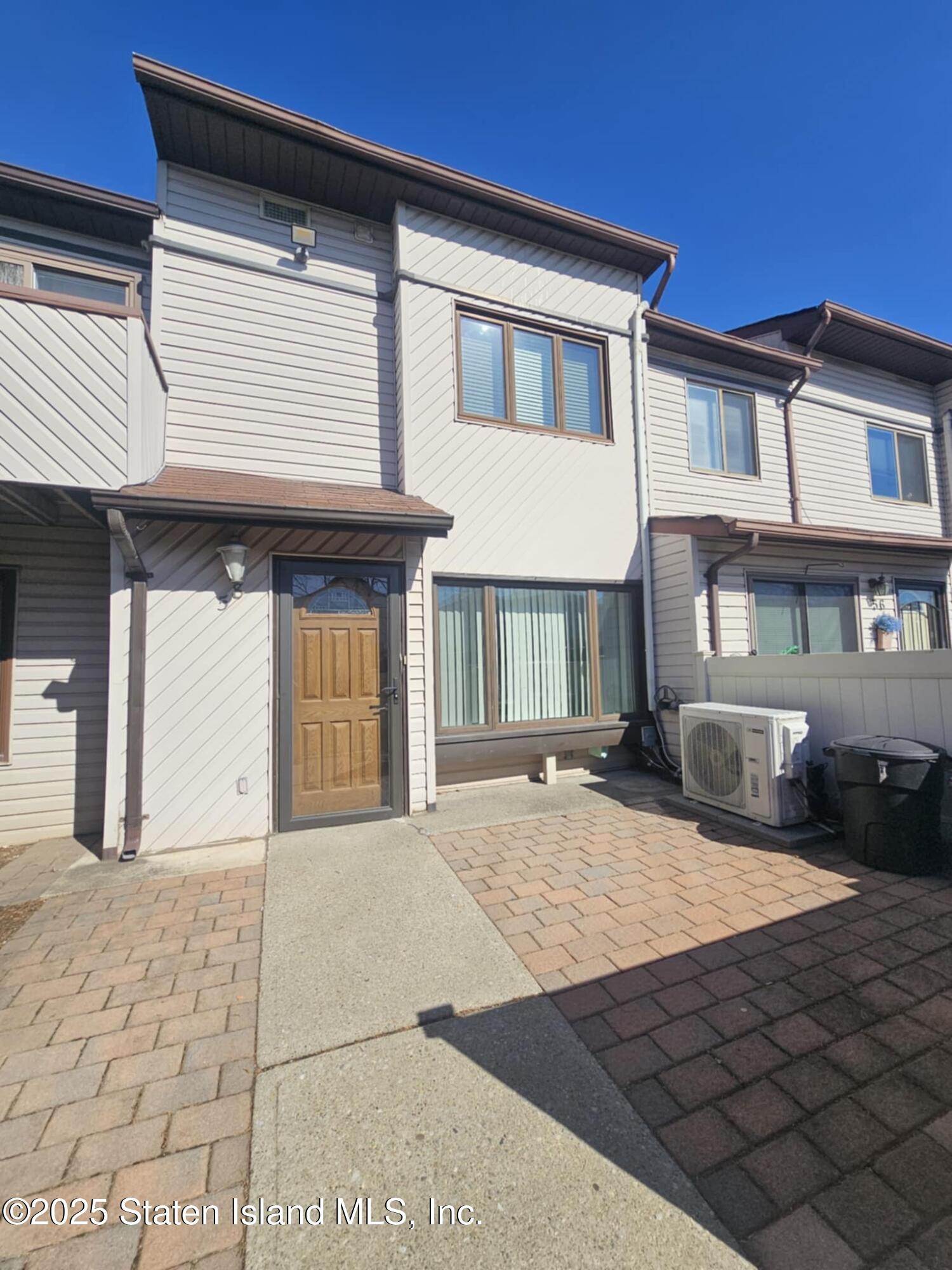 58 Selvin Loop Staten Island, NY 10303 - Photo 2 of 19 a view of a house with a patio