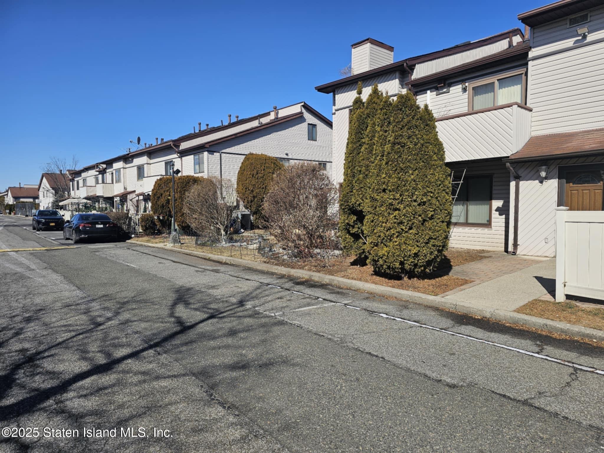 58 Selvin Loop Staten Island, NY 10303 - Photo 3 of 19 a car parked in front of house