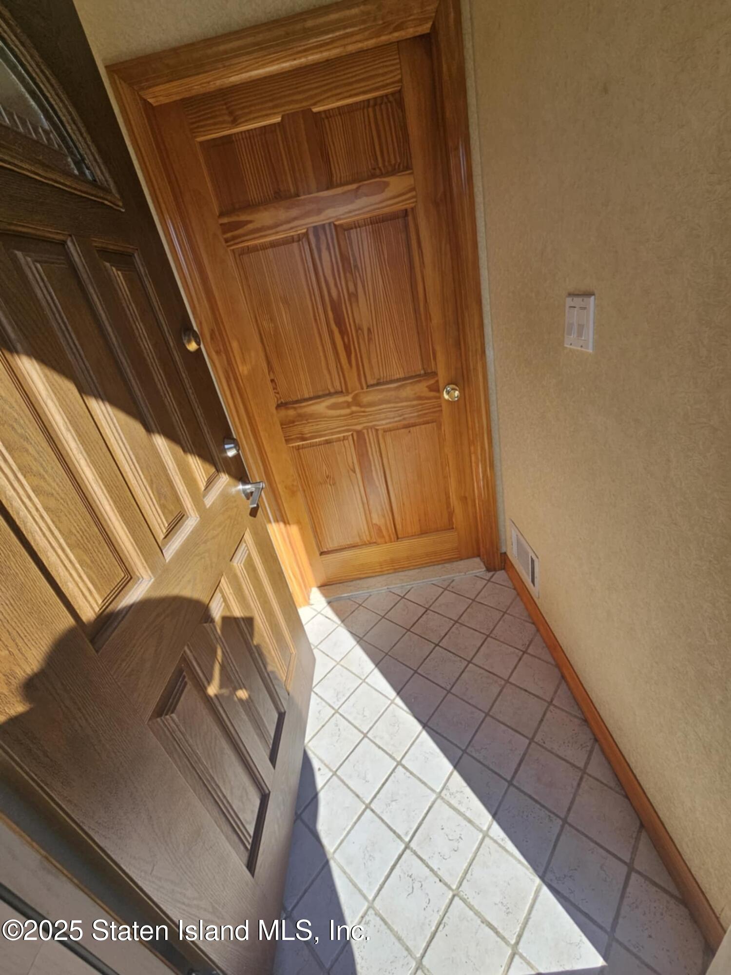 58 Selvin Loop Staten Island, NY 10303 - Photo 5 of 19 a view of front door