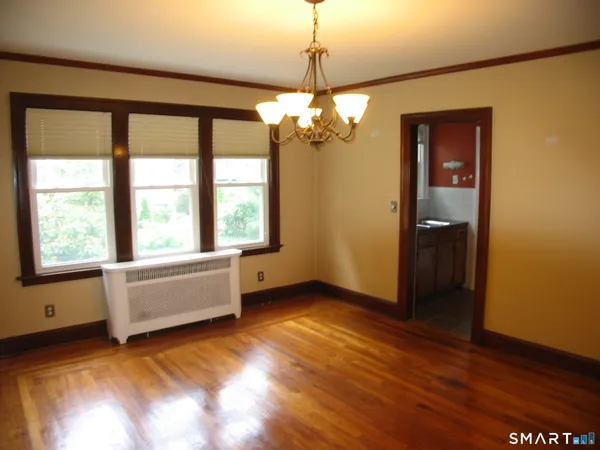 a view of livingroom with window ceiling fan and hardwood floor