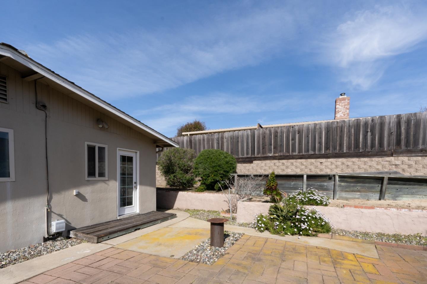 301 Park Circle Marina, CA 93933 - Photo 17 of 18 a view of a house with backyard and sitting area