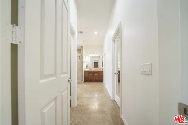 a bathroom with a toilet a sink and shower