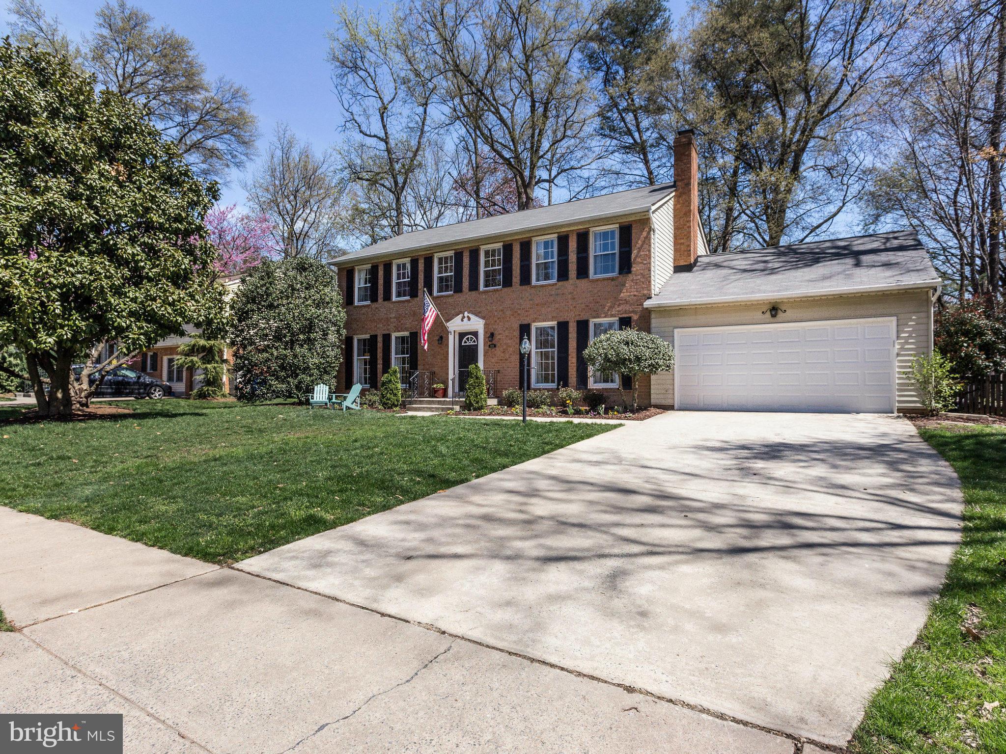 8231 Crown Court Road Alexandria, VA 22308 - Photo 2 of 30 a view of a white house with a yard