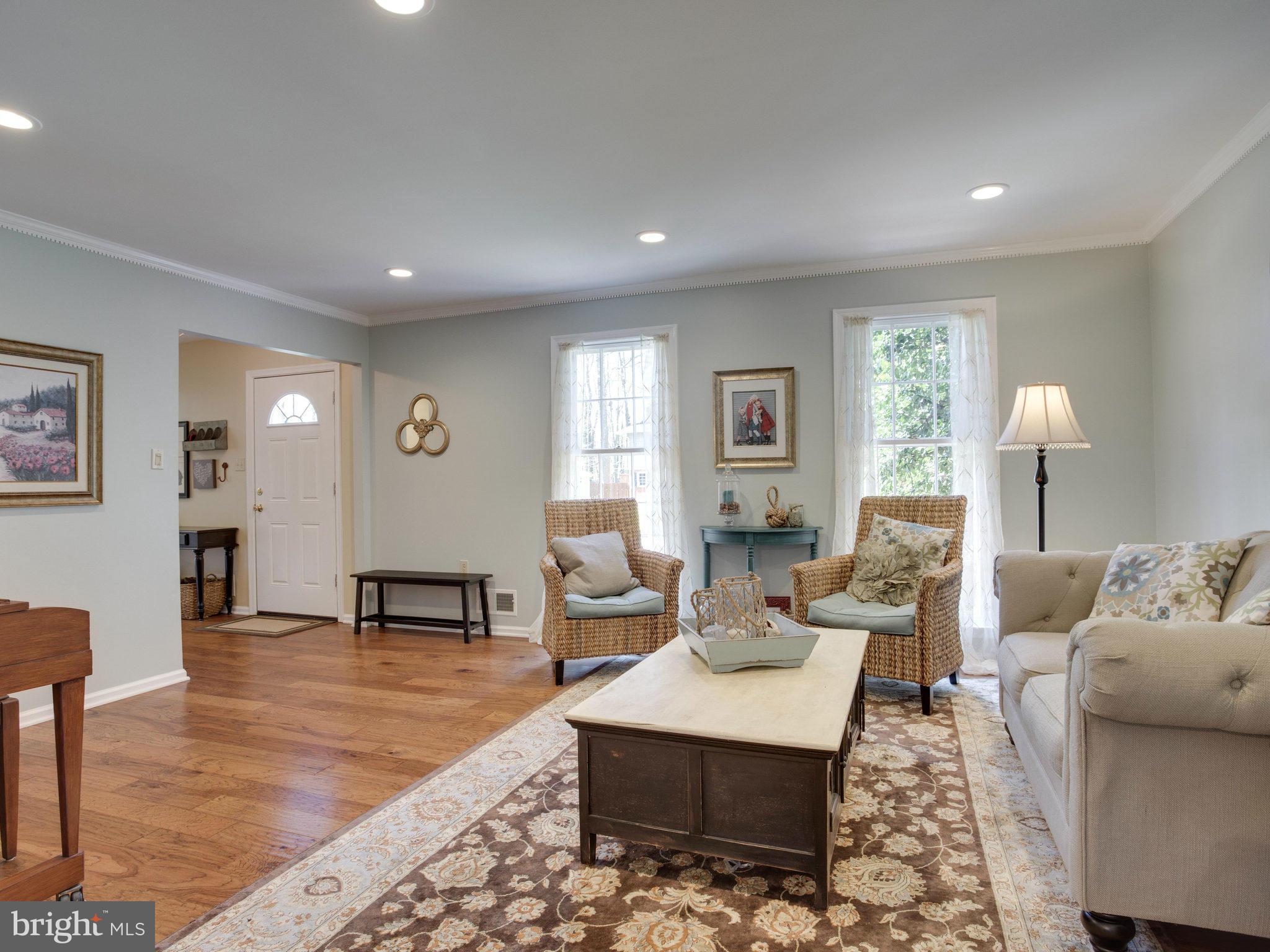 8231 Crown Court Road Alexandria, VA 22308 - Photo 12 of 30 a living room with furniture and a table