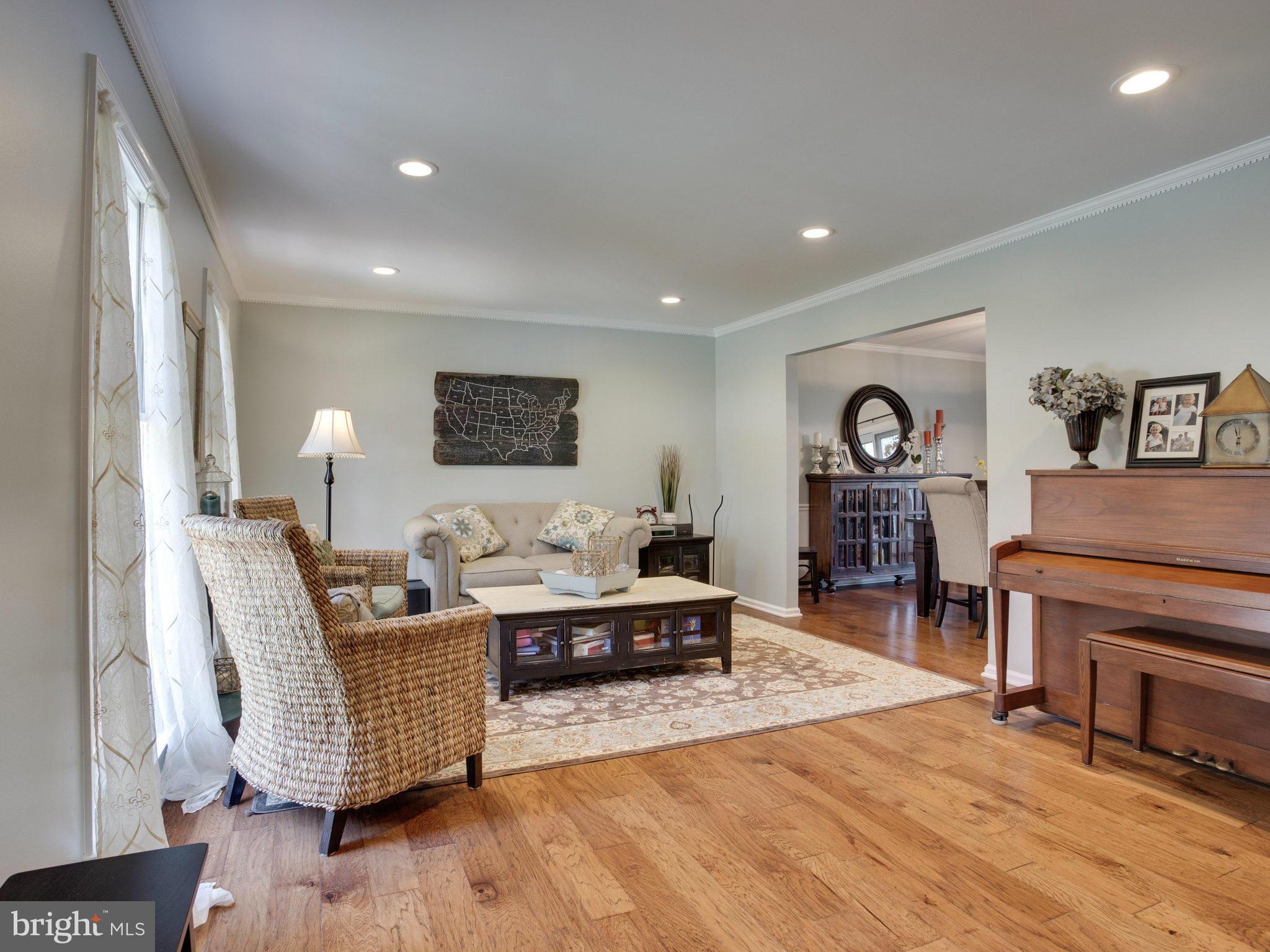 8231 Crown Court Road Alexandria, VA 22308 - Photo 13 of 30 a living room with furniture and a wooden floor