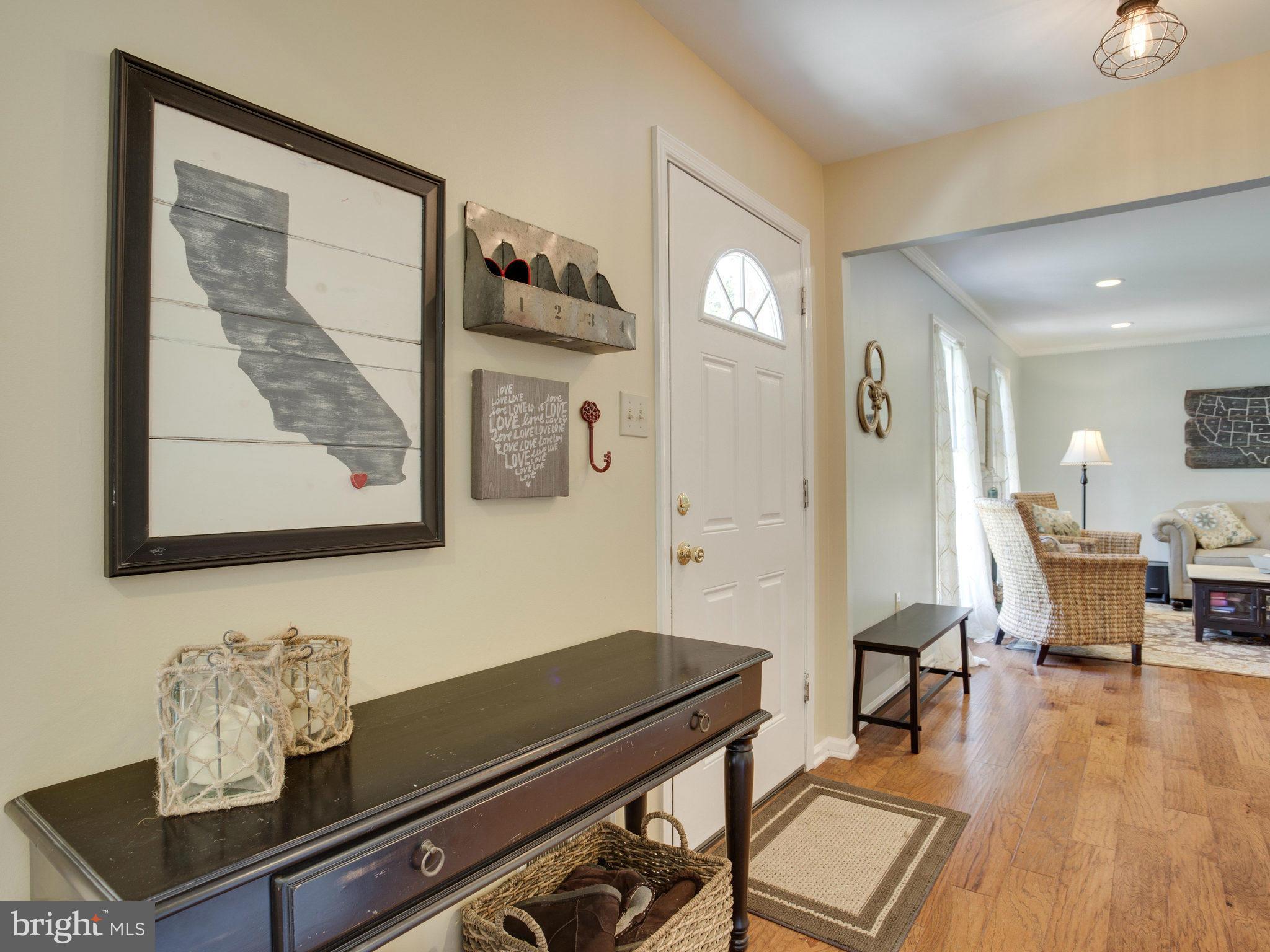 8231 Crown Court Road Alexandria, VA 22308 - Photo 14 of 30 a living room with furniture and wooden floor