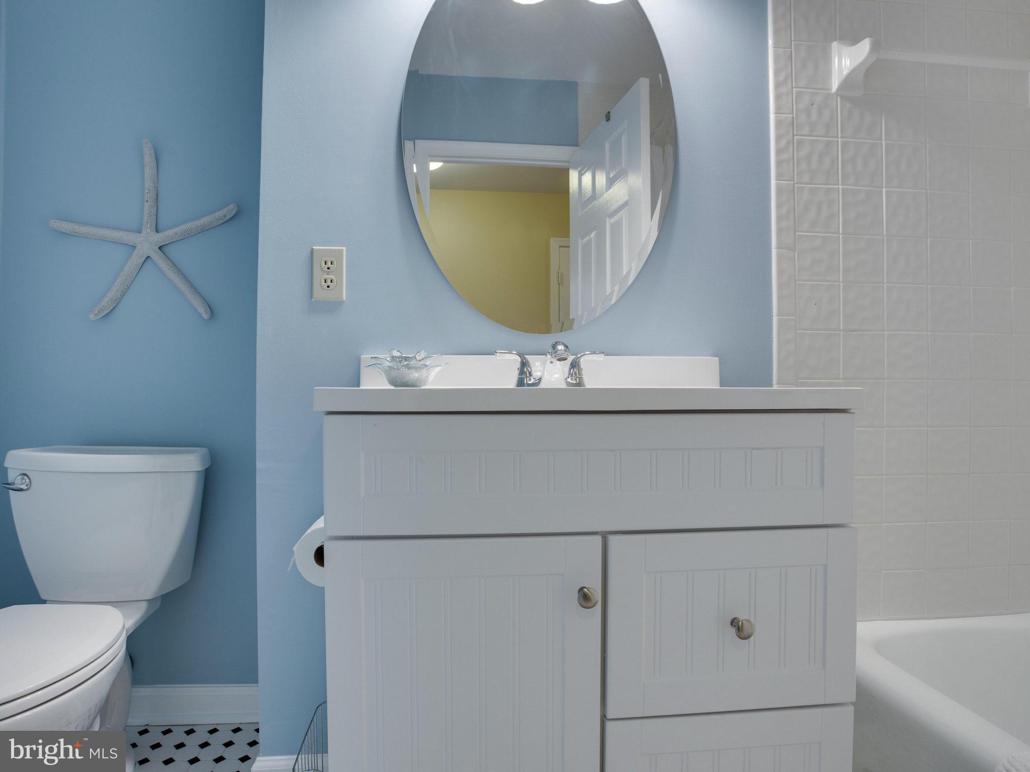 8231 Crown Court Road Alexandria, VA 22308 - Photo 21 of 30 a bathroom with a toilet a sink and mirror