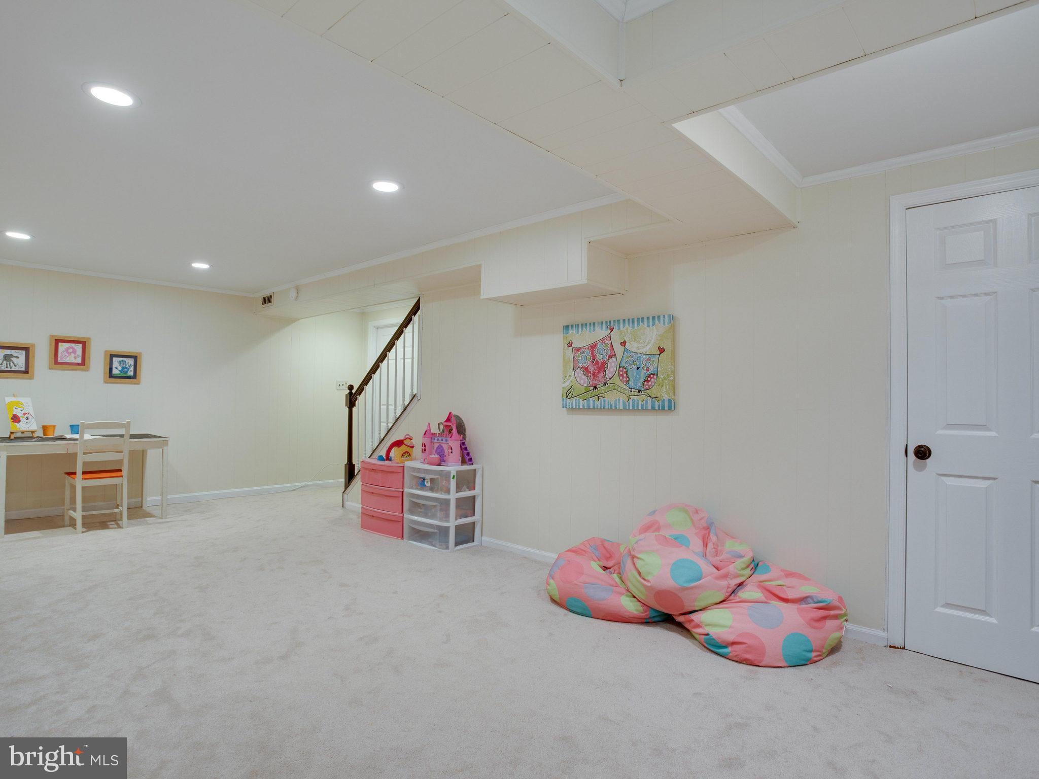 8231 Crown Court Road Alexandria, VA 22308 - Photo 25 of 30 a room with toys and couches