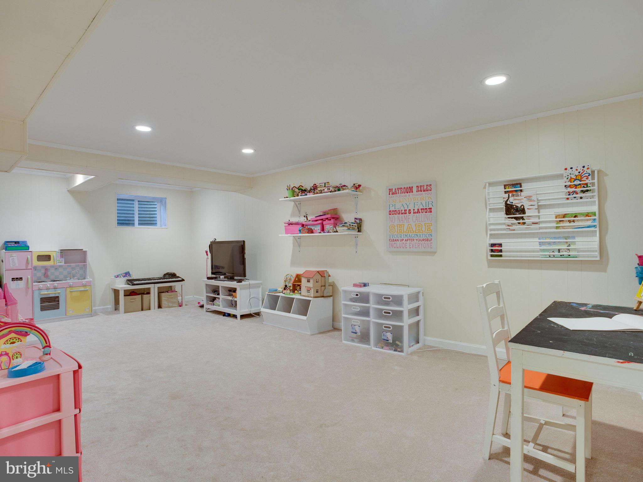 8231 Crown Court Road Alexandria, VA 22308 - Photo 26 of 30 a living room with furniture and a flat screen tv