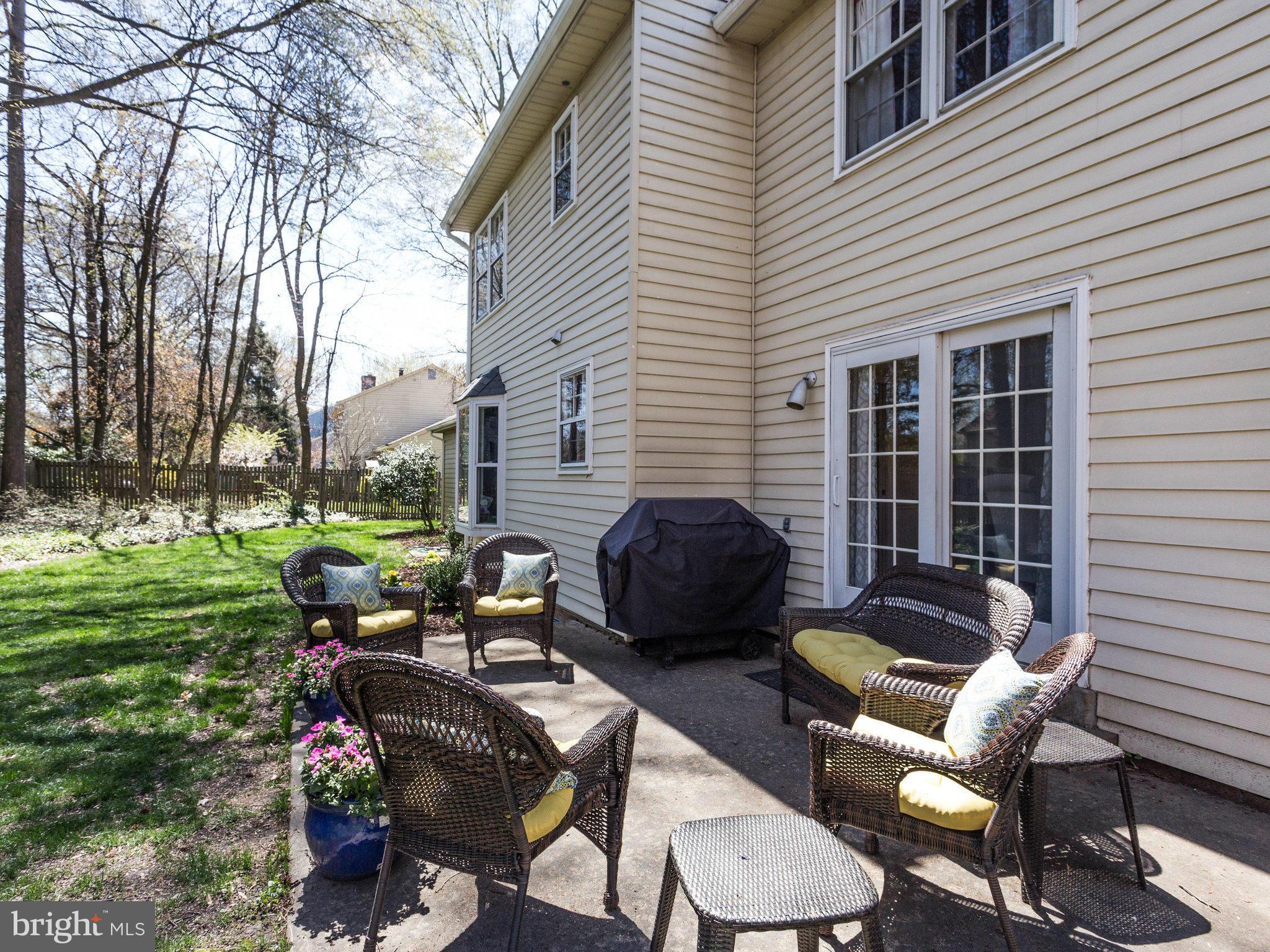 8231 Crown Court Road Alexandria, VA 22308 - Photo 28 of 30 a view of a patio with couple of chairs and a fire pit