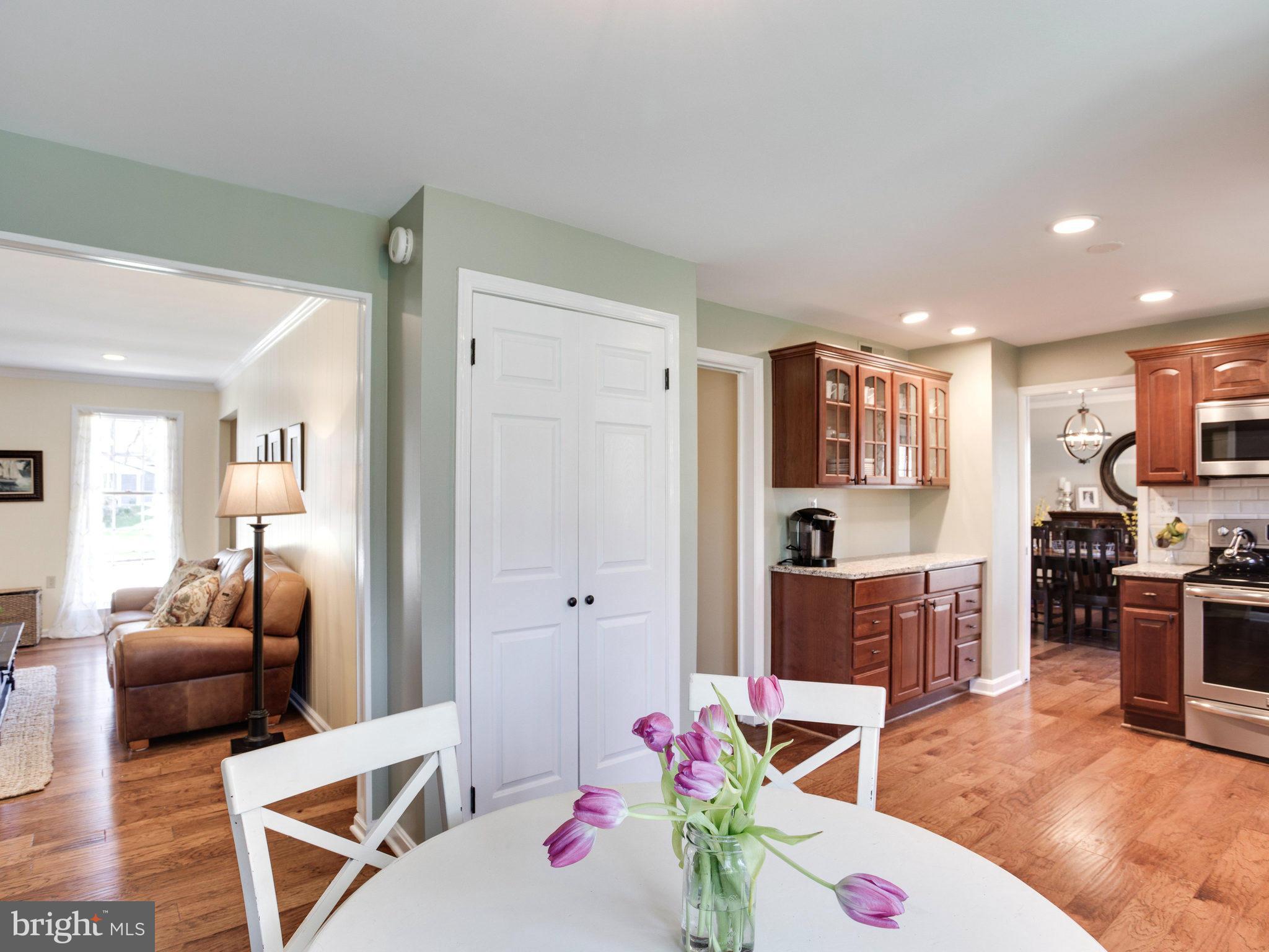 8231 Crown Court Road Alexandria, VA 22308 - Photo 6 of 30 a living room with furniture and a flat screen tv