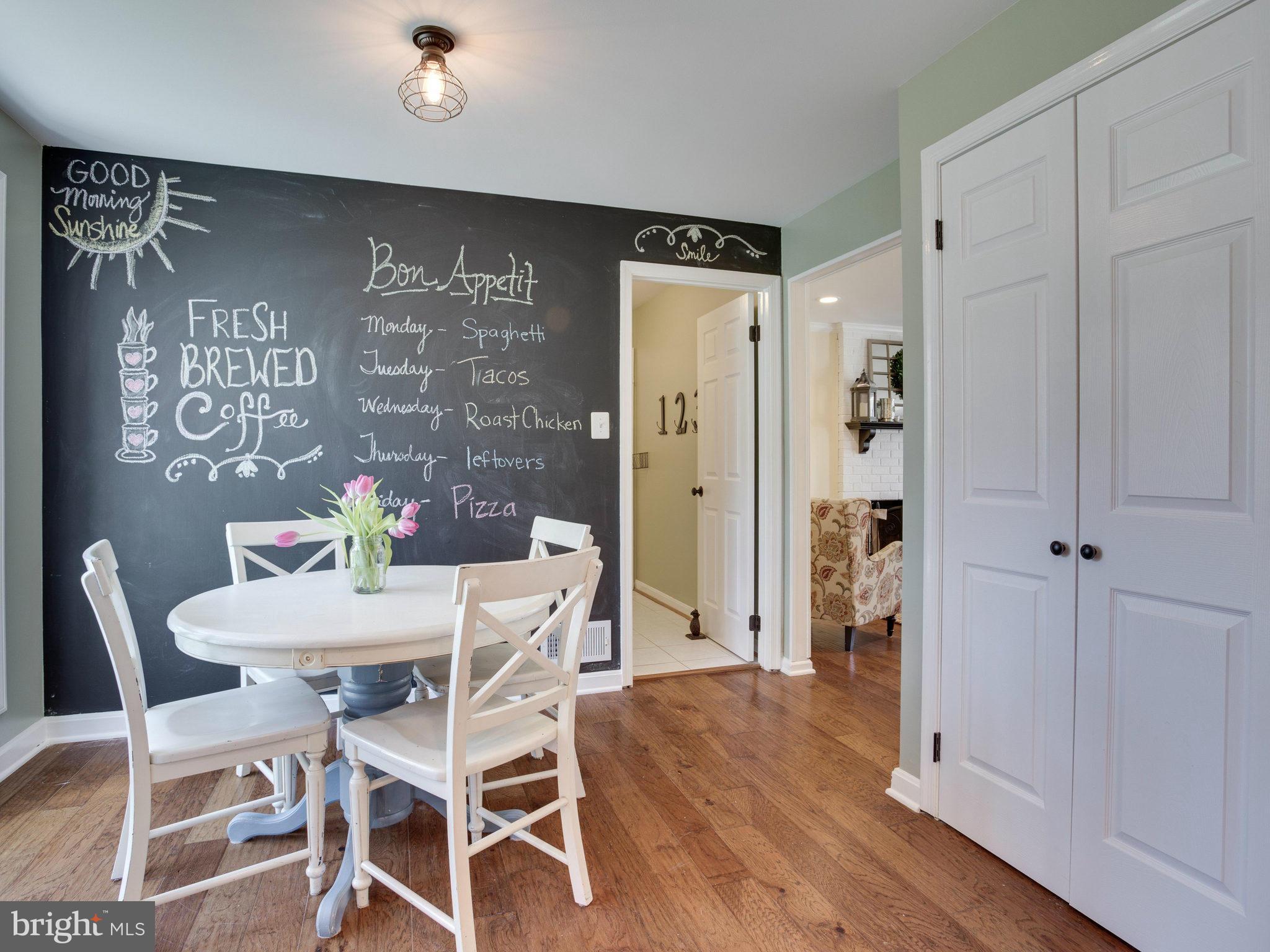 8231 Crown Court Road Alexandria, VA 22308 - Photo 8 of 30 a view of a dining room with furniture and wooden floor