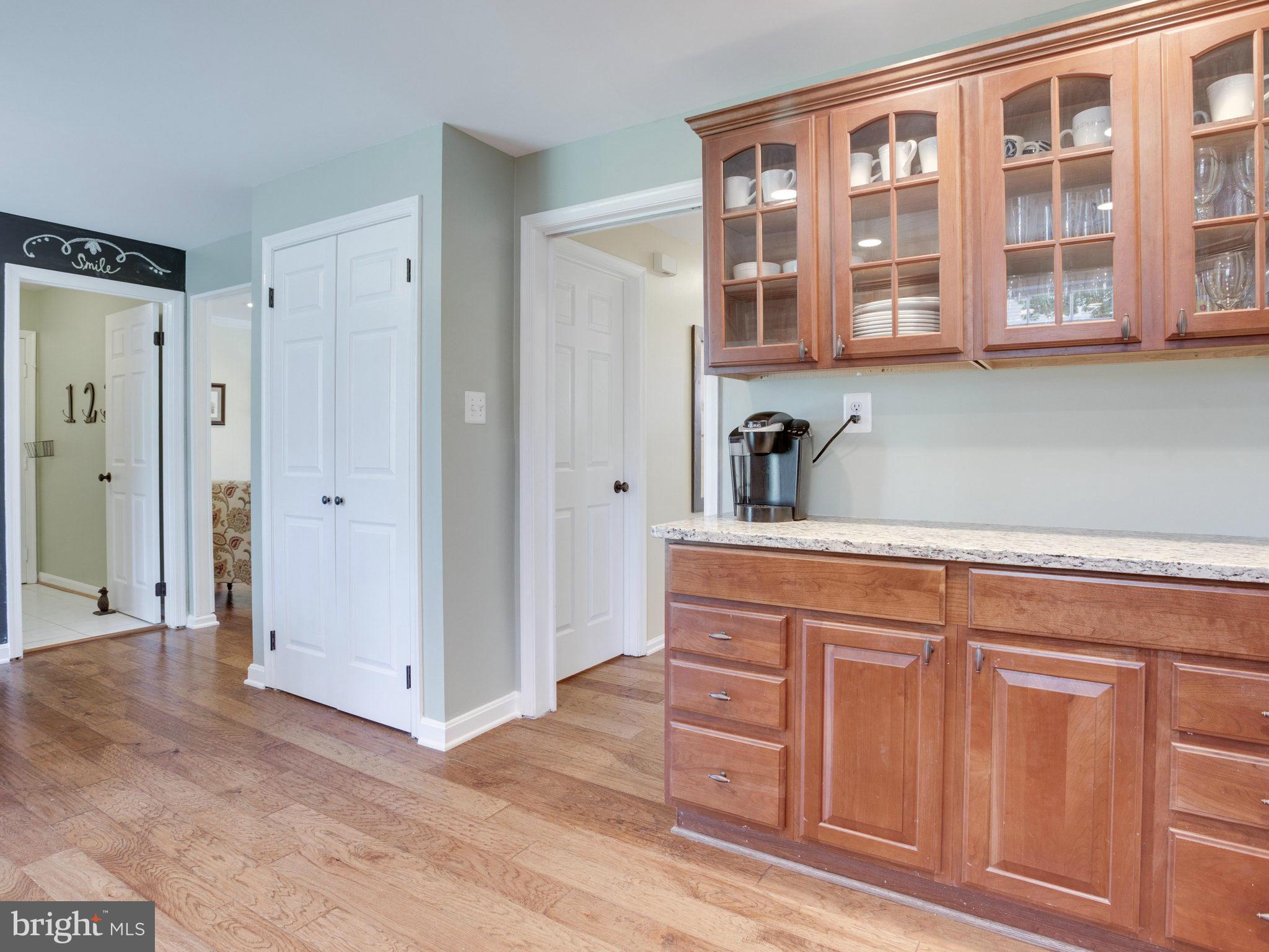 8231 Crown Court Road Alexandria, VA 22308 - Photo 9 of 30 a kitchen with stainless steel appliances granite countertop a refrigerator and a sink