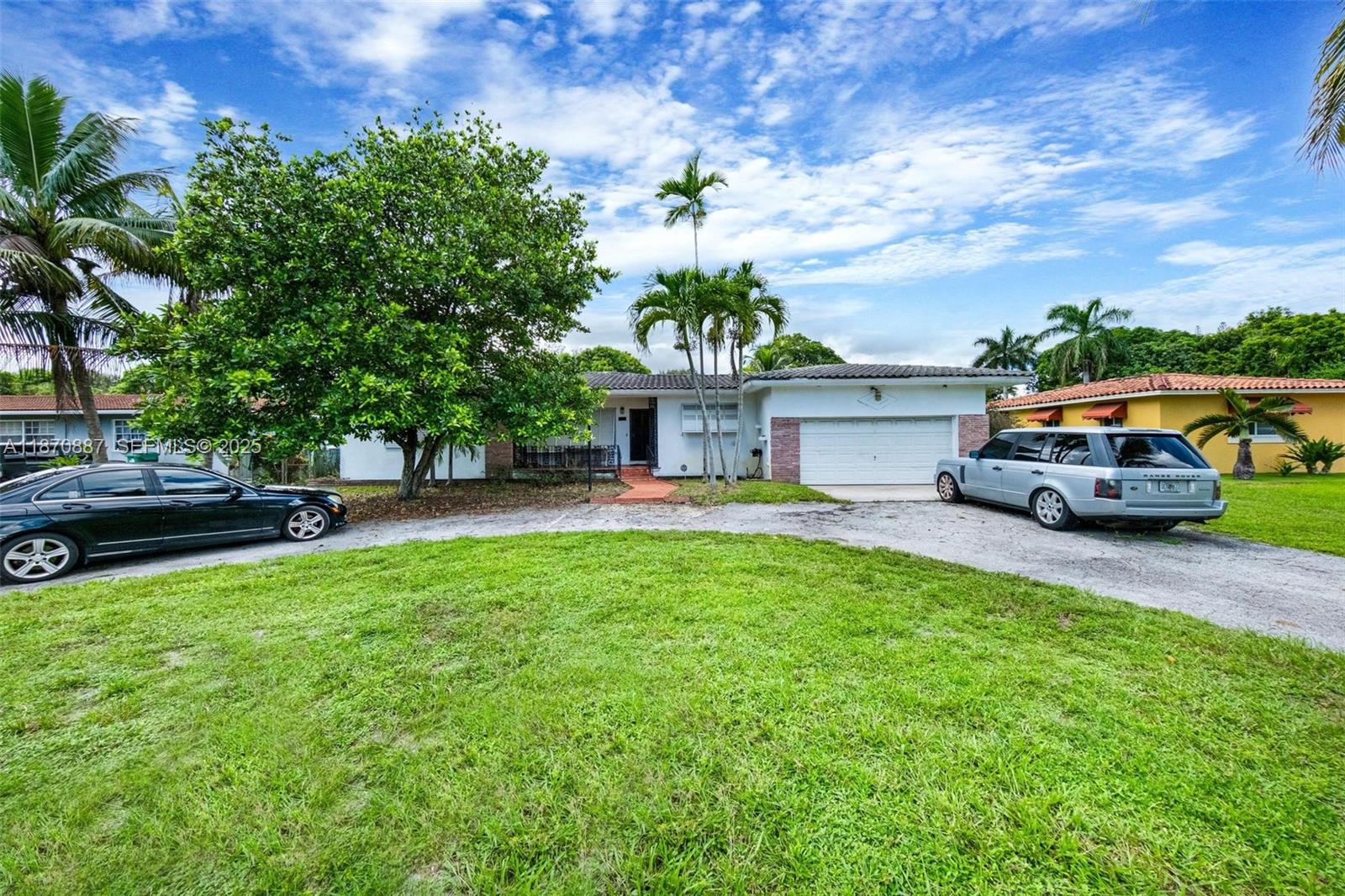 14150 Northwest 2nd Avenue Miami, FL 33168 - Photo 1 of 38 a house view with a garden space