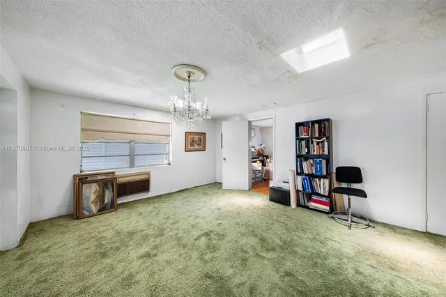 a living room with furniture and a chair