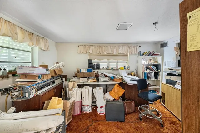 a view of a workspace with furniture