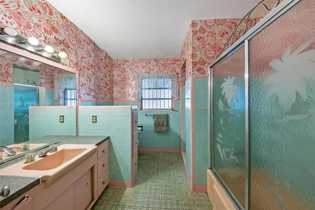 a living room with furniture and a dresser