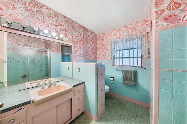 a living room with furniture and a dresser