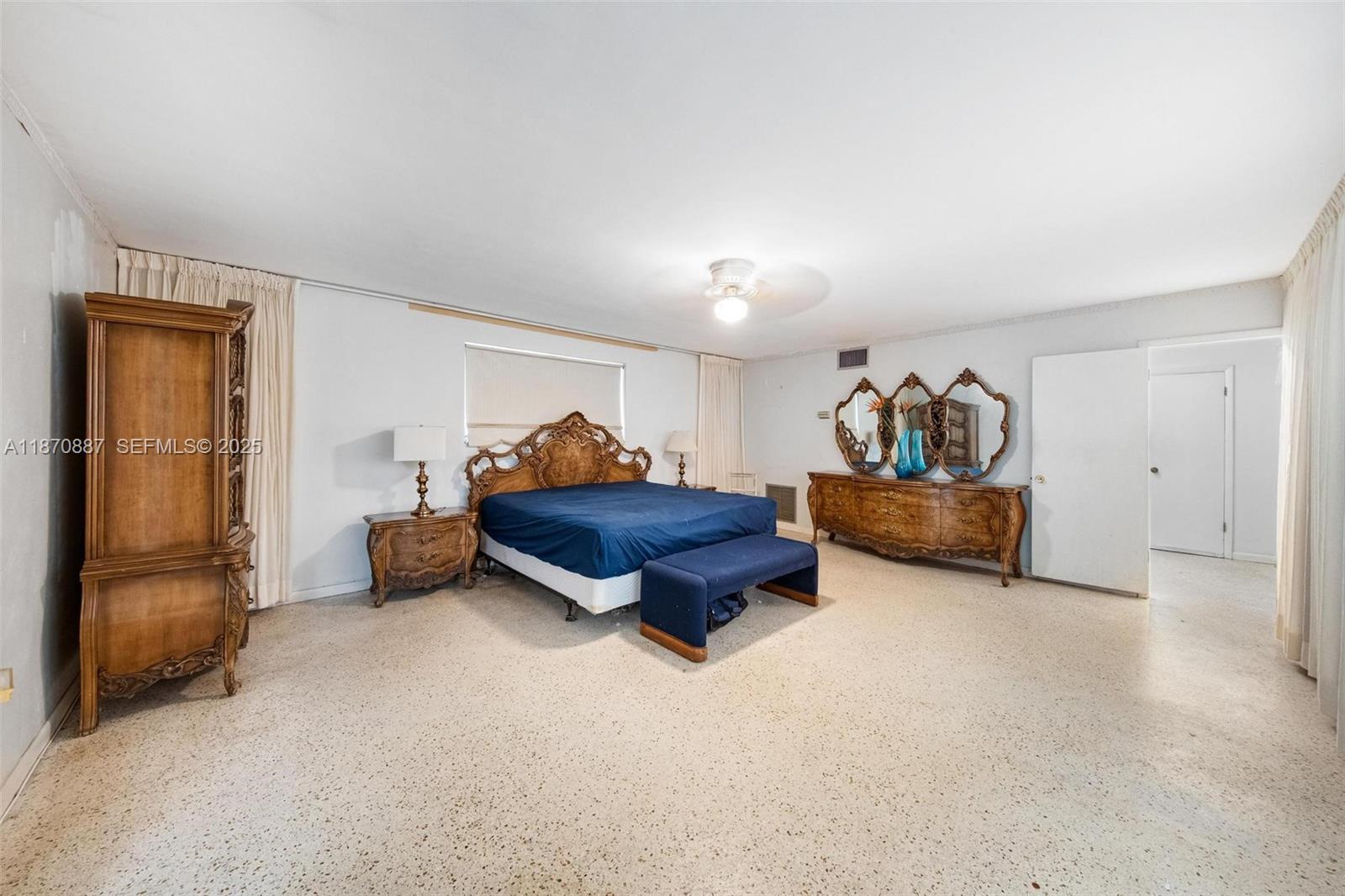 14150 Northwest 2nd Avenue Miami, FL 33168 - Photo 24 of 38 a living room with furniture and a lamp