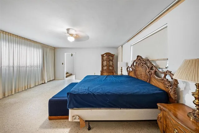 a bathroom with a granite countertop toilet a sink and shower
