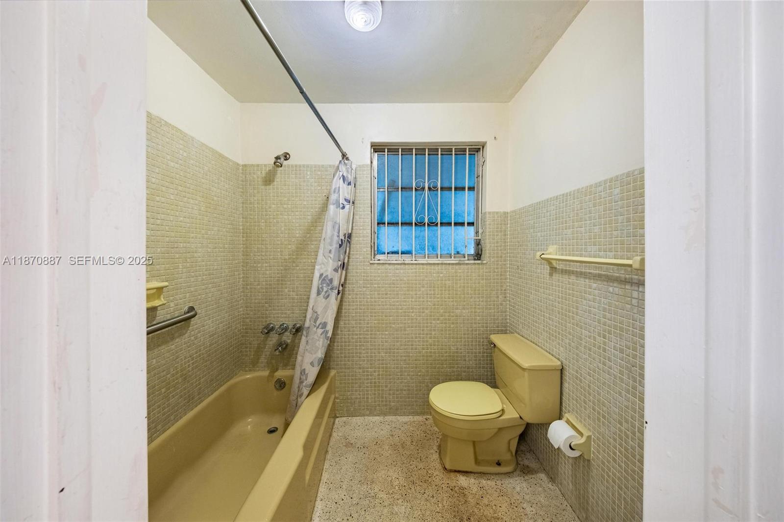 14150 Northwest 2nd Avenue Miami, FL 33168 - Photo 29 of 38 a bathroom with a granite countertop toilet a sink and shower