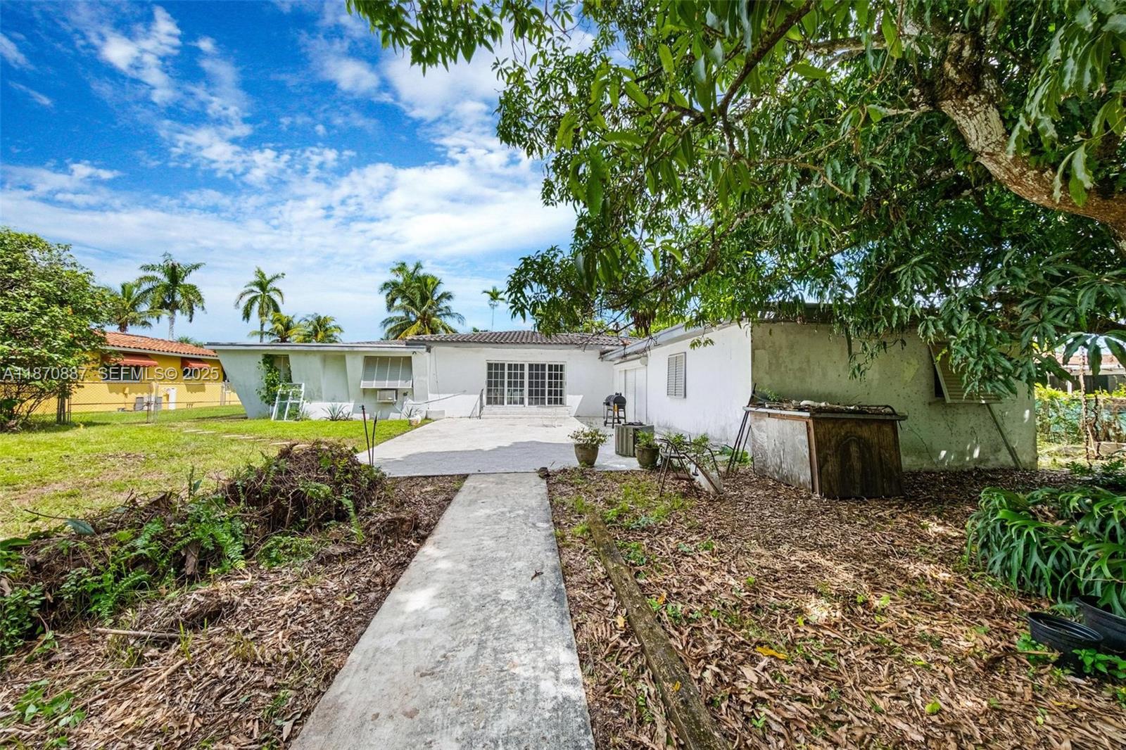 14150 Northwest 2nd Avenue Miami, FL 33168 - Photo 33 of 38 a front view of a house with garden