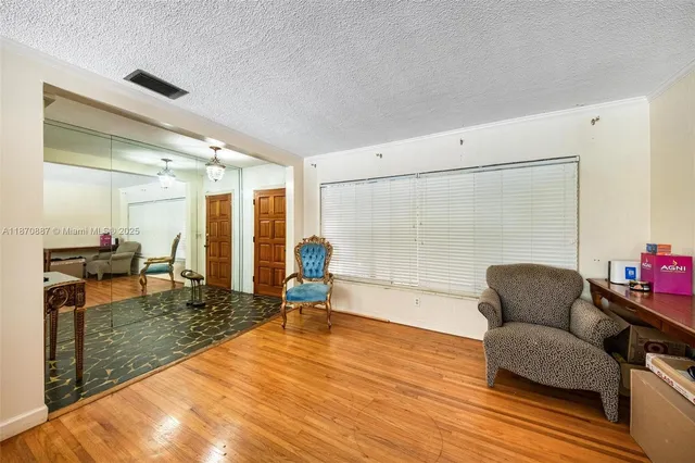a living room with furniture and a table