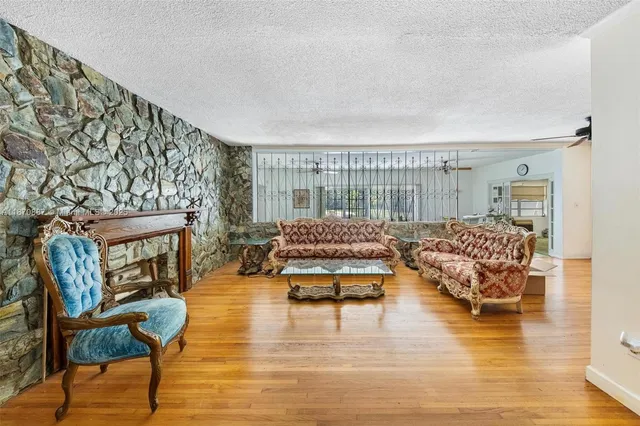 a living room with furniture and a table