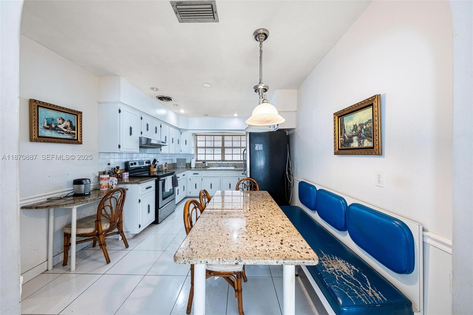 14150 Northwest 2nd Avenue Miami, FL 33168 - Photo 9 of 38 a view of a dining room with furniture