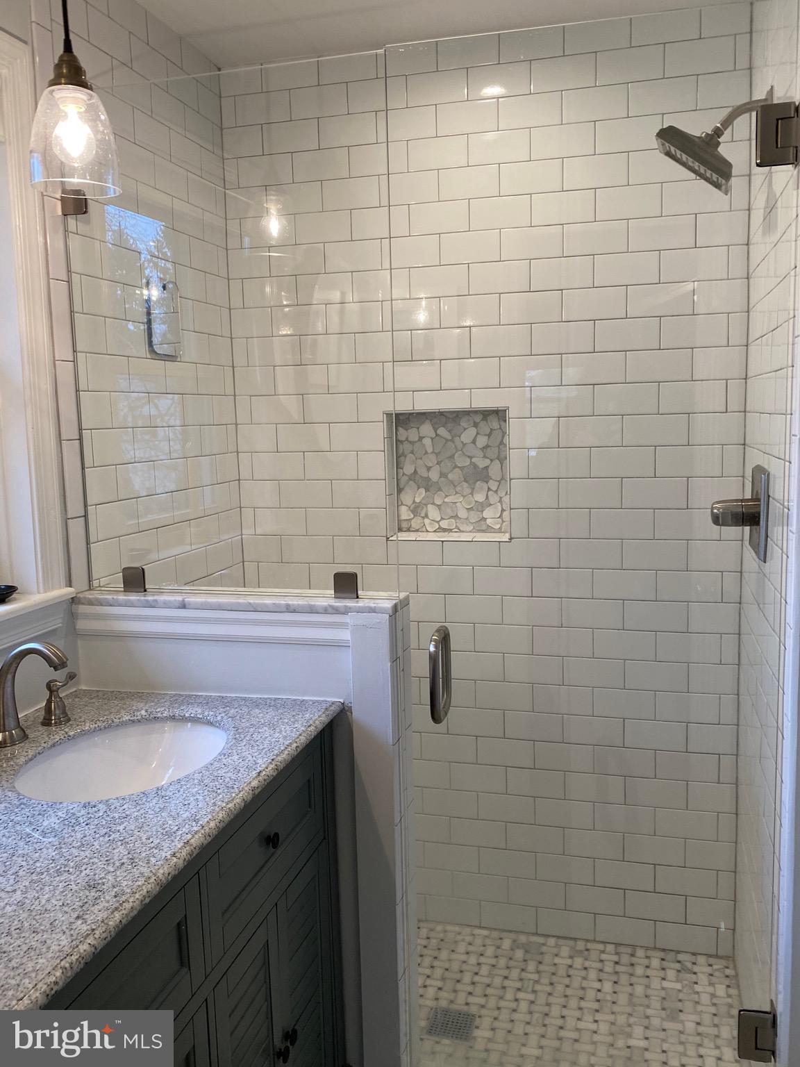 204 Brookmead Road Wayne, PA 19087 - Photo 32 of 43 GORGEOUS tiled shower with frameless glass door
