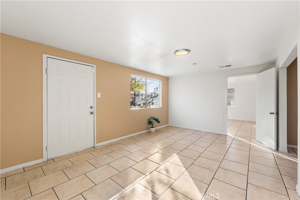 1252 East Ave R 6 Palmdale, CA 93550 - Photo 17 of 40 a view of an empty room and window