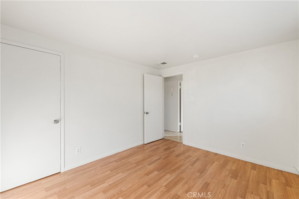 1252 East Ave R 6 Palmdale, CA 93550 - Photo 27 of 40 a view of empty room with wooden floor
