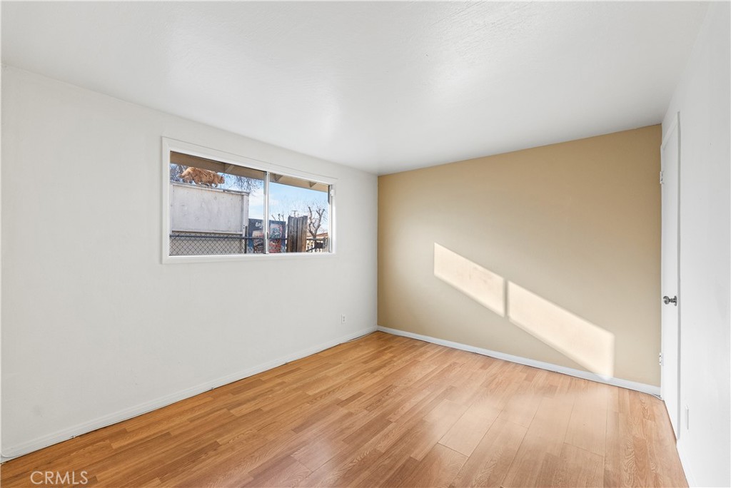 1252 East Ave R 6 Palmdale, CA 93550 - Photo 28 of 40 a view of empty room with wooden floor