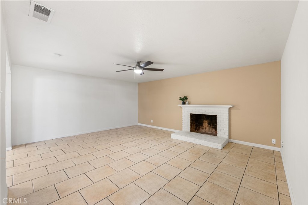 1252 East Ave R 6 Palmdale, CA 93550 - Photo 3 of 40 a view of an empty room with a fireplace