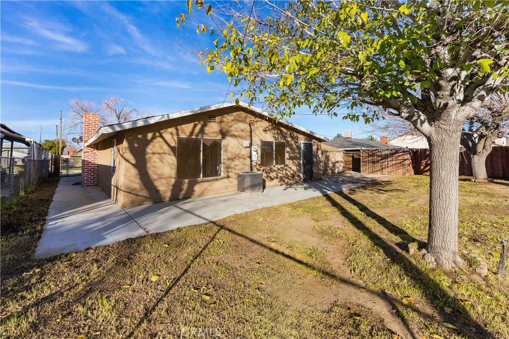 1252 East Ave R 6 Palmdale, CA 93550 - Photo 37 of 40 a view of swimming pool with lounge chair