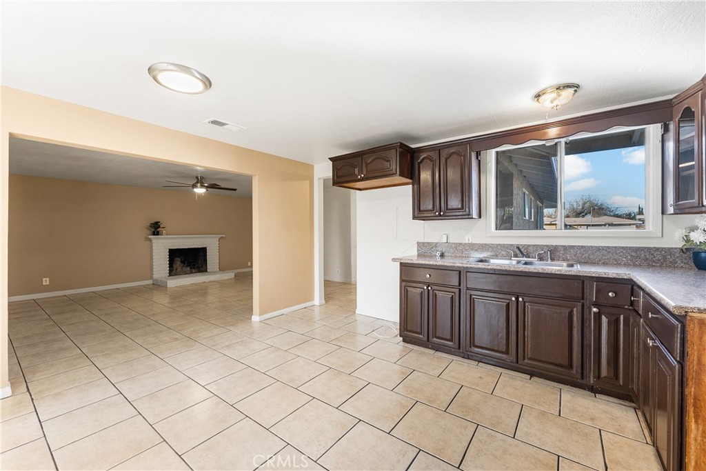 1252 East Ave R 6 Palmdale, CA 93550 - Photo 10 of 40 a spacious bathroom with a granite countertop sink and mirror
