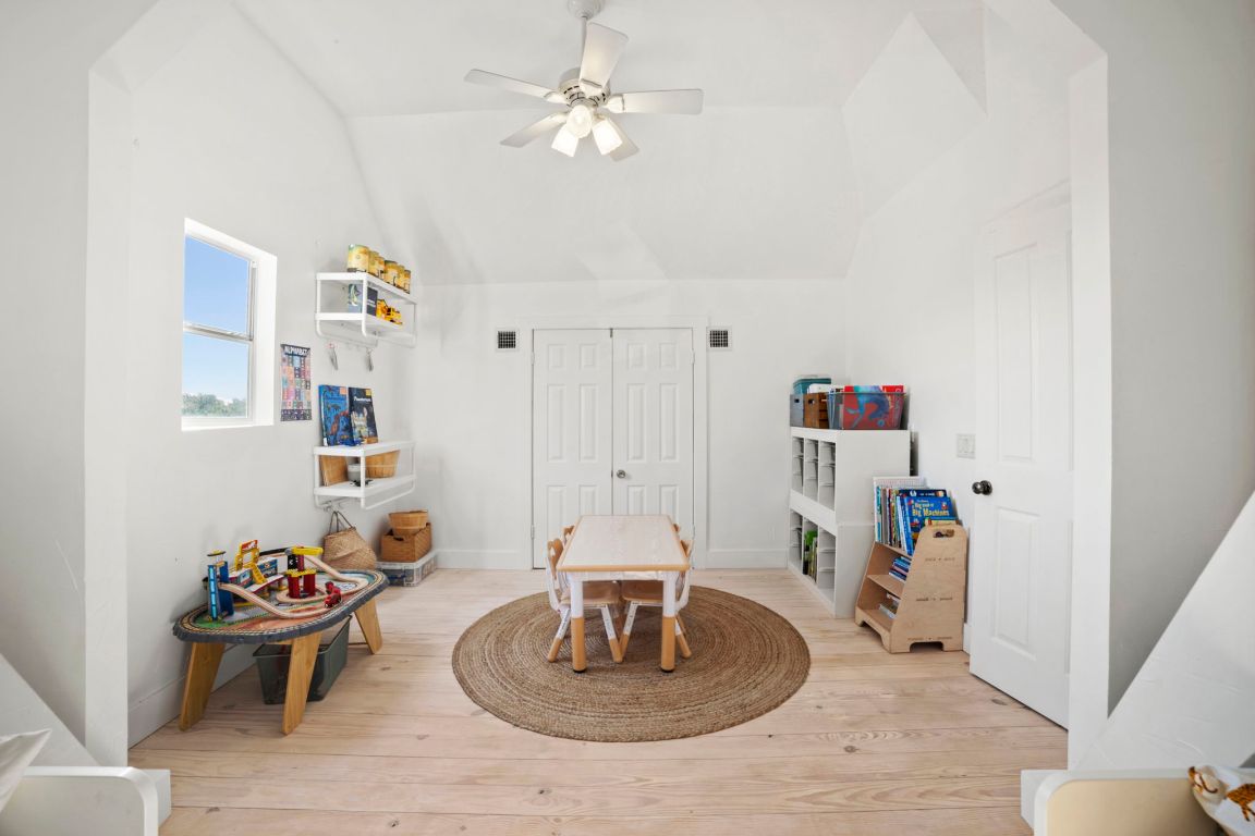 7197 Mt Sharp Road Wimberley, TX 78676 - Photo 20 of 39 a living room with furniture and a table
