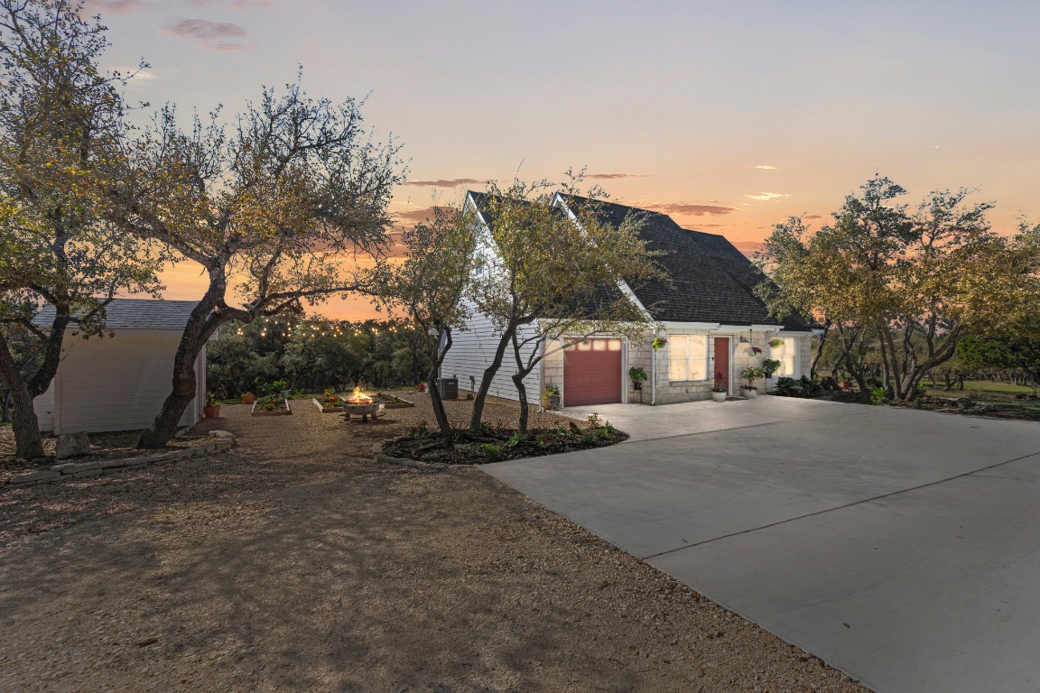 7197 Mt Sharp Road Wimberley, TX 78676 - Photo 2 of 39 a view of a house with a yard and roof